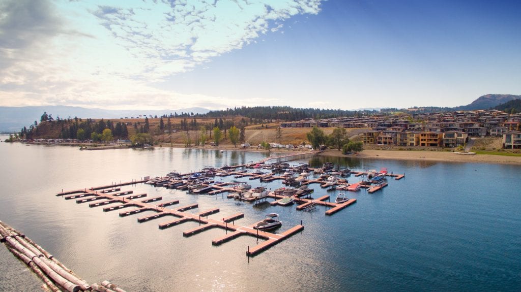 aerial shot of the marina facing west harbour development community with mountains in view