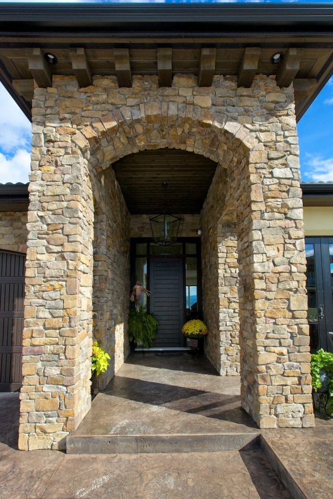 mediterranean style arches leading into a doorway of a west harbour home