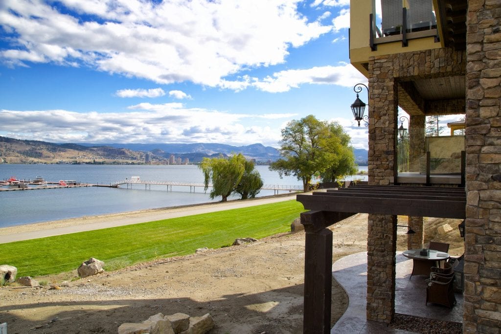 lakefront home in peripheral view overlooking the marina and beach