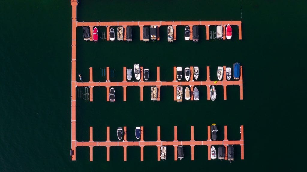 directly from above aerial shot of the marina with some boats docked there